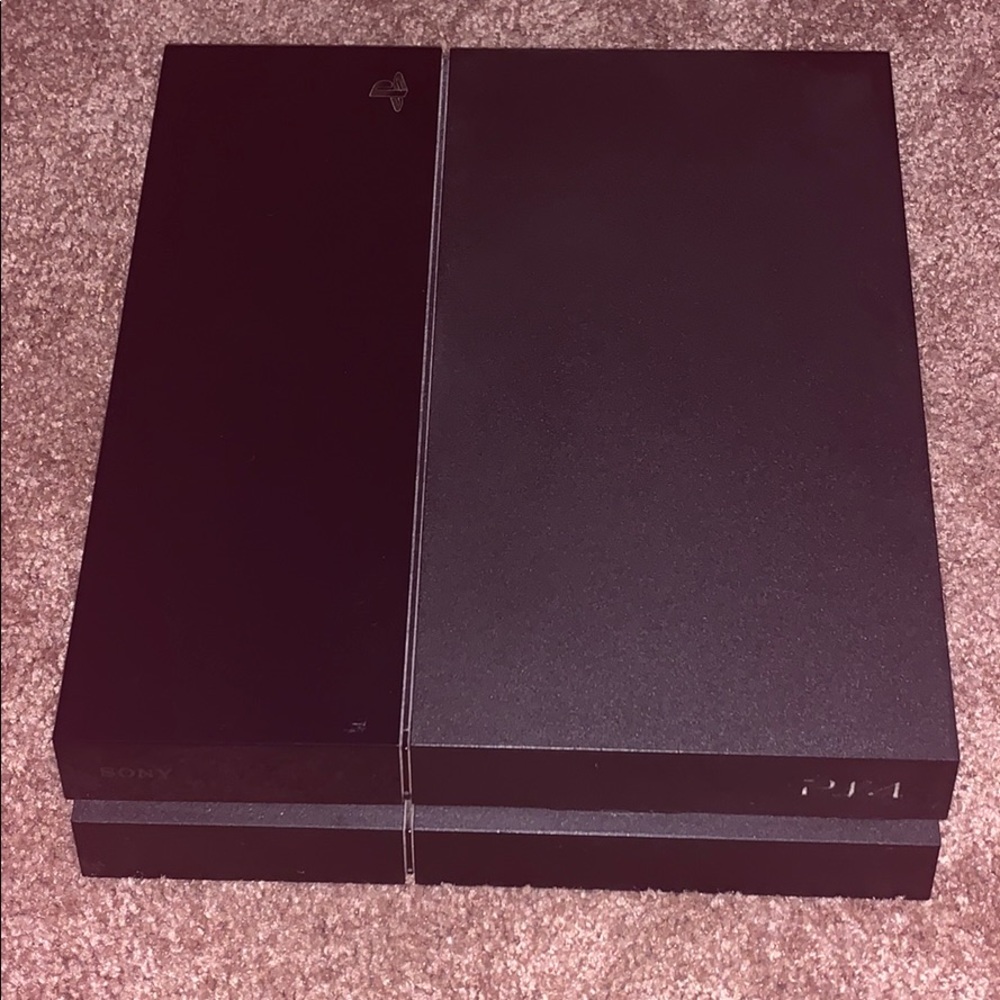 PlayStation four with 3 controllers and 7 games